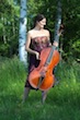 Leonor Palazzo in a park holding her cello